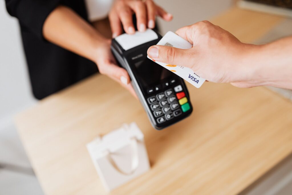 Customer tapping a credit card on a card terminal